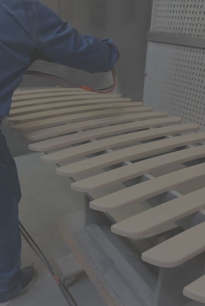 Person finishing wood in workshop